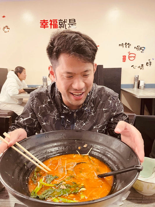 Chef enjoying a delicious meal cooked at  his restaunrant