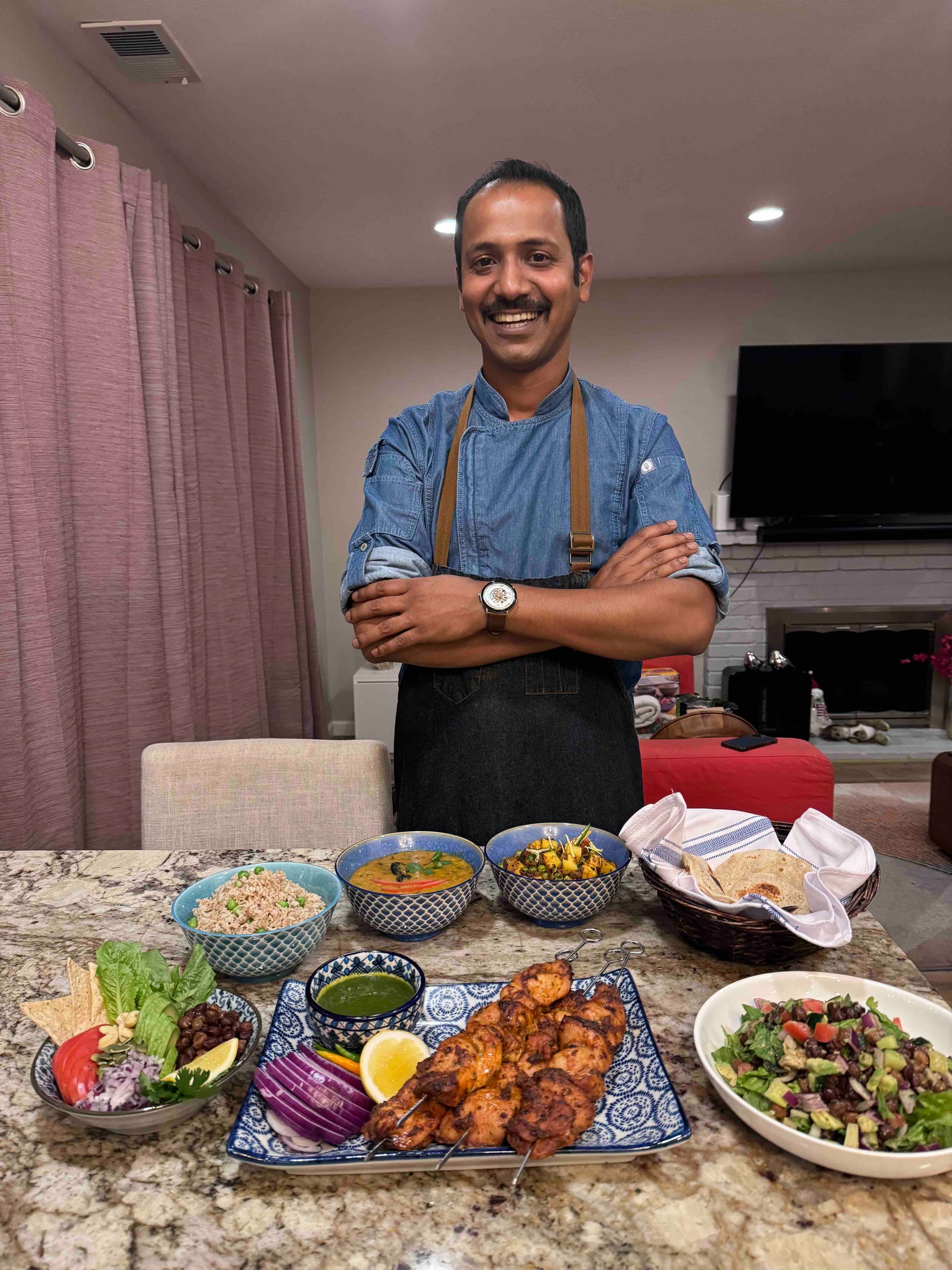Indian Chef Bikram Standing Next to Meal Prep Done At A Client's Place